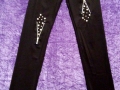 Leggins cremalleras y atachuelado